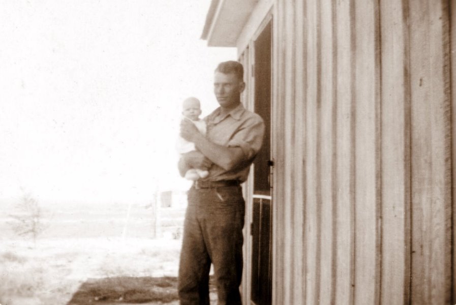 1938-09-11 George proudly shows off his two-month-old daughter Georgia Ruth